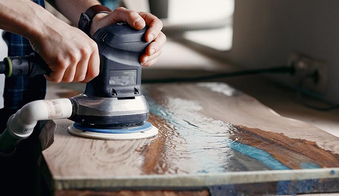 A person is polishing furniture