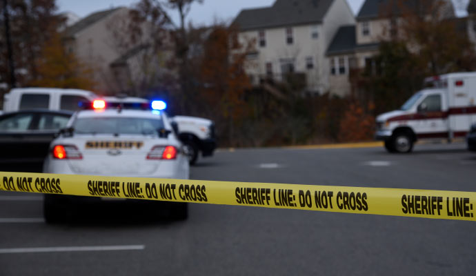 Yellow police tape sealing off an accident scene for investigation