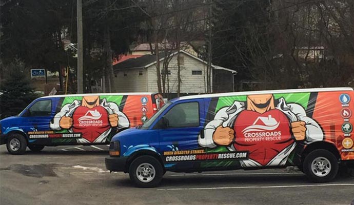 Crossroads property rescue service vans.