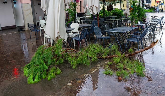 A storm-damaged outdoor restaurant patio area