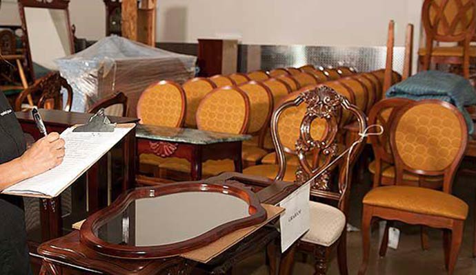 A person listing out inventory