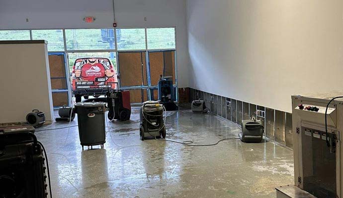 Crossroads Property Rescue industrial drying equipment and dehumidifiers drying flooded interior