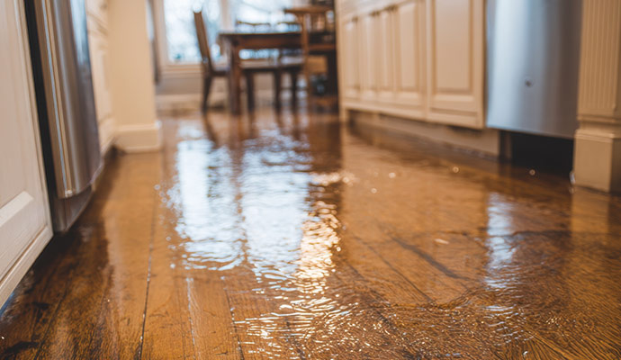 Damaged kitchen floor from water line break