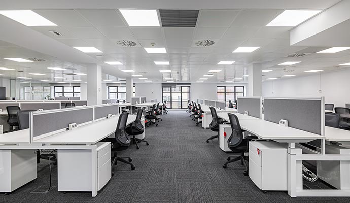 Modern office interior with neatly arranged chairs and tables