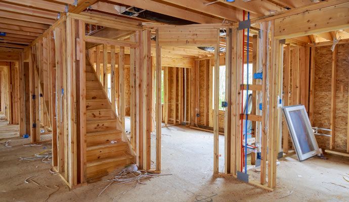 Professional residential reconstruction service “Home interior being rebuilt during residential reconstruction process