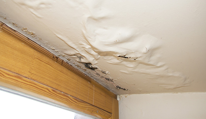 Water damaged ceiling due to roof leak
